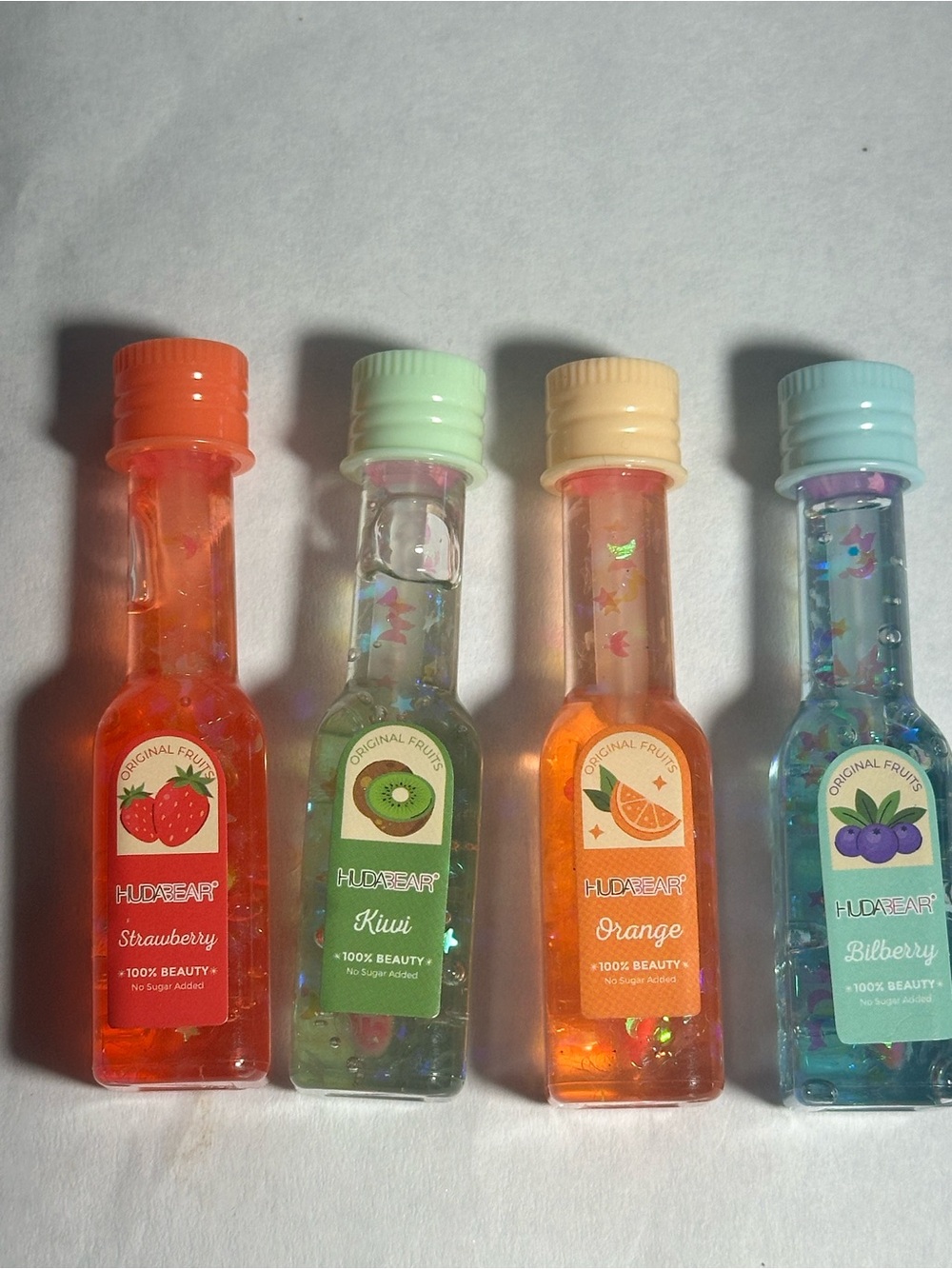 Hudabeaut Fruit Scented Lip Gloss Set - Cherry , Kiwi, Orange, Bilberry